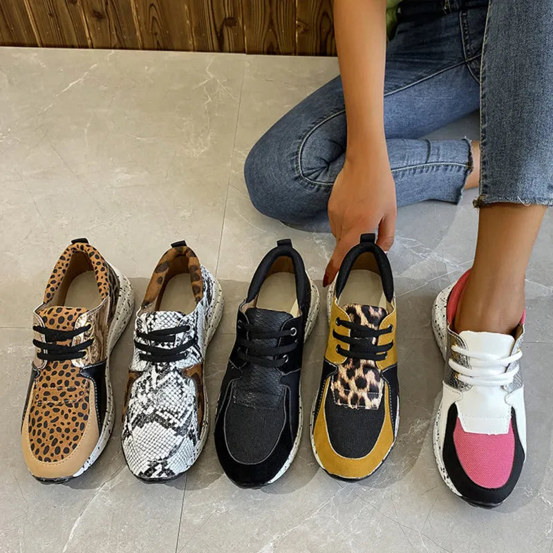 Women's suede sneakers with a wedge heel in various colours on a white background.