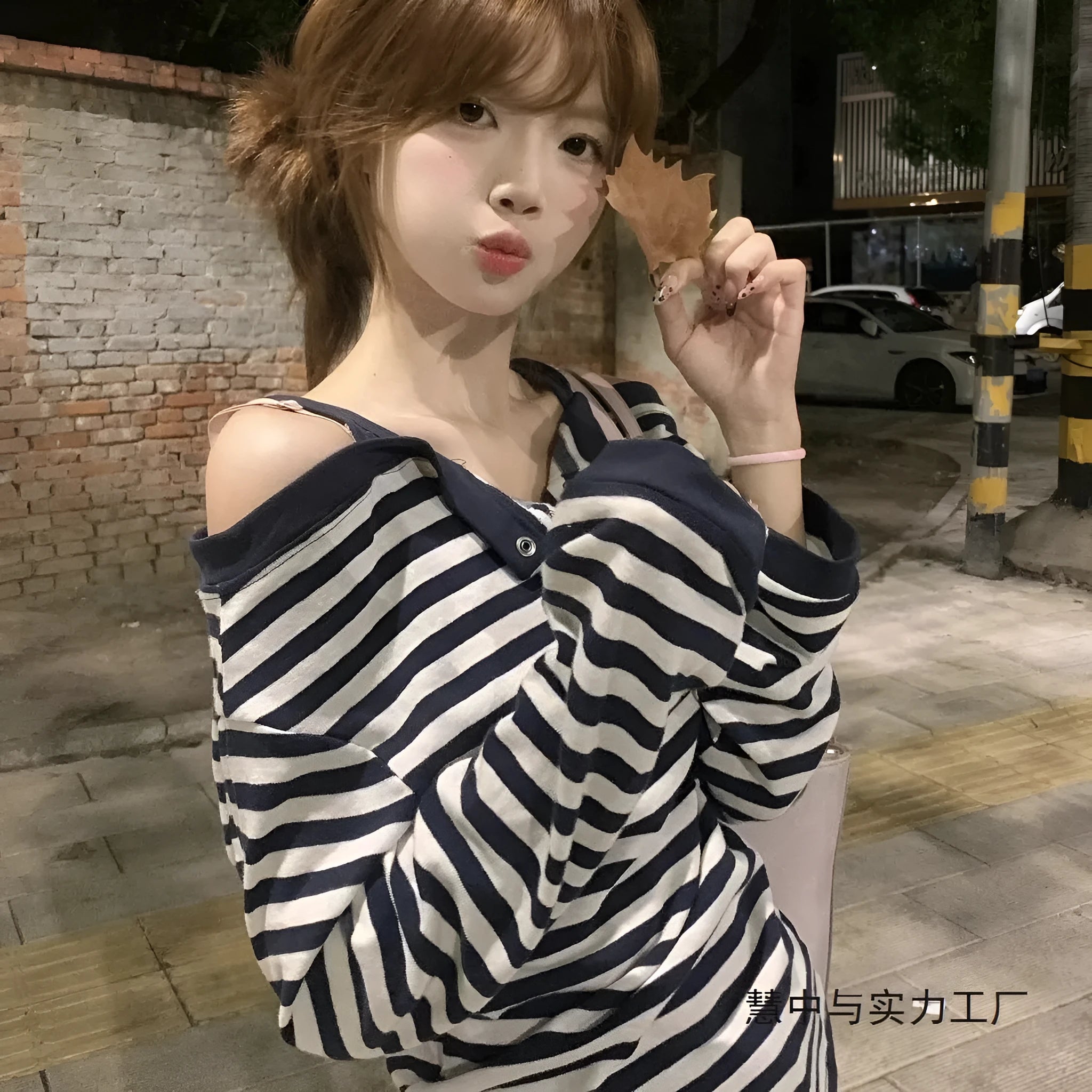 Dark blue Korean-style oversized women's t-shirt with long sleeves, stripes, and embroidery details.