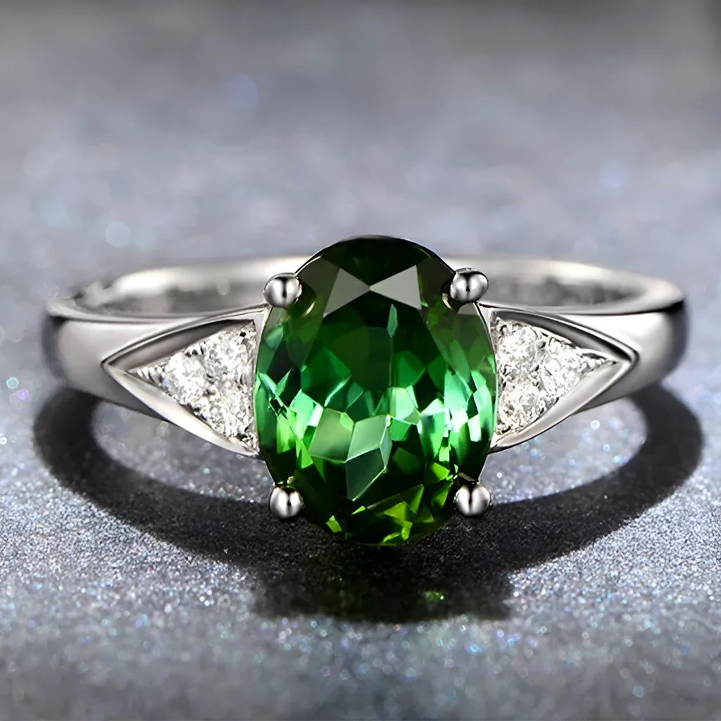 A ladies' court style ring with natural zircon inlay forming heart, water drop, and bell patterns on a silver-toned band.