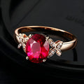 Women's butterfly ring with heart-shaped design and red or blue enamel options on rose gold plating