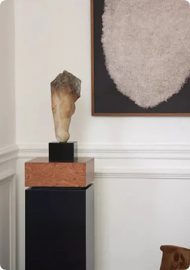Abstract bronze horse head desktop sculpture with carved texture on a wooden table.