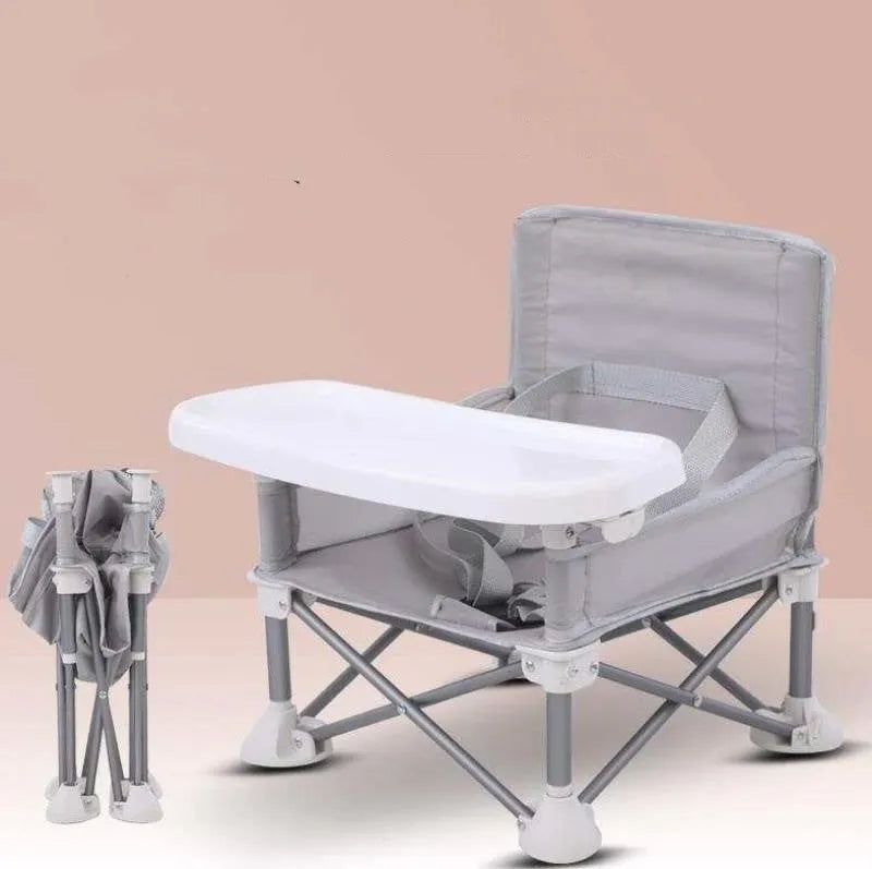 Foldable baby dining chair in folding grey with removable tray and safety belt, includes storage bag