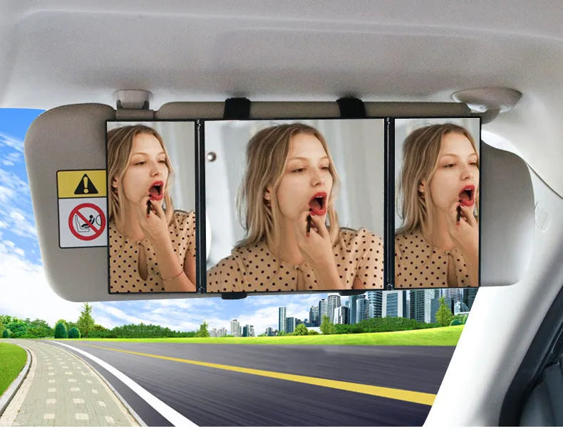 Silver car folding grooming mirror shown opened and closed on a car dashboard.