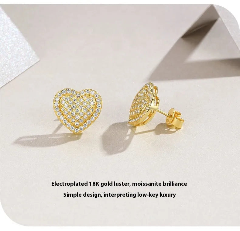 Golden heart-shaped stud earrings made from S925 silver with gold plating.