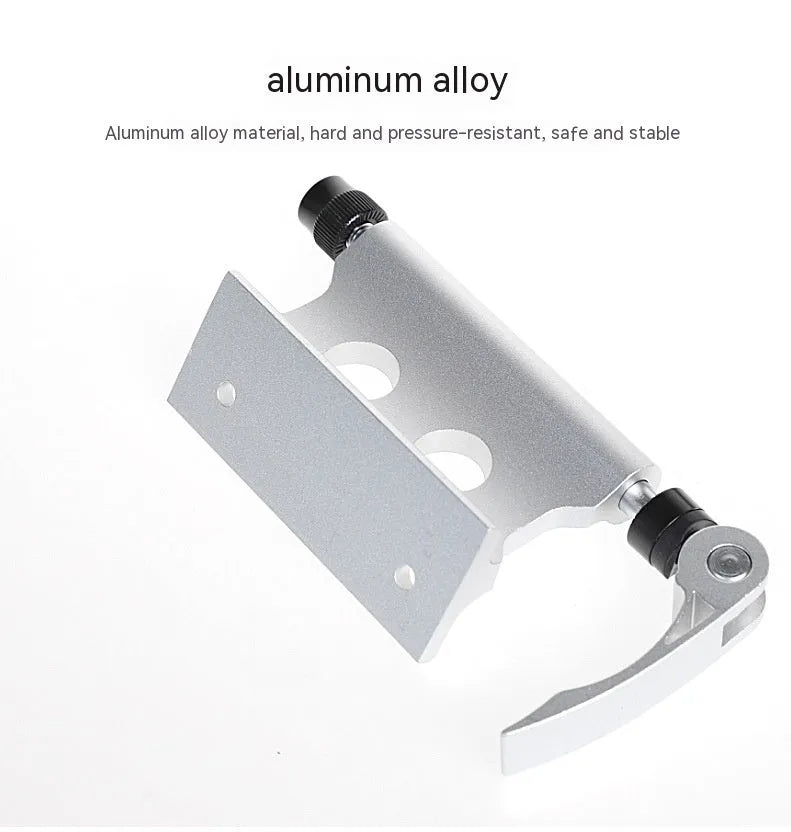 Silver metal quick release fixing clamp for mounting accessories on a bicycle front fork.