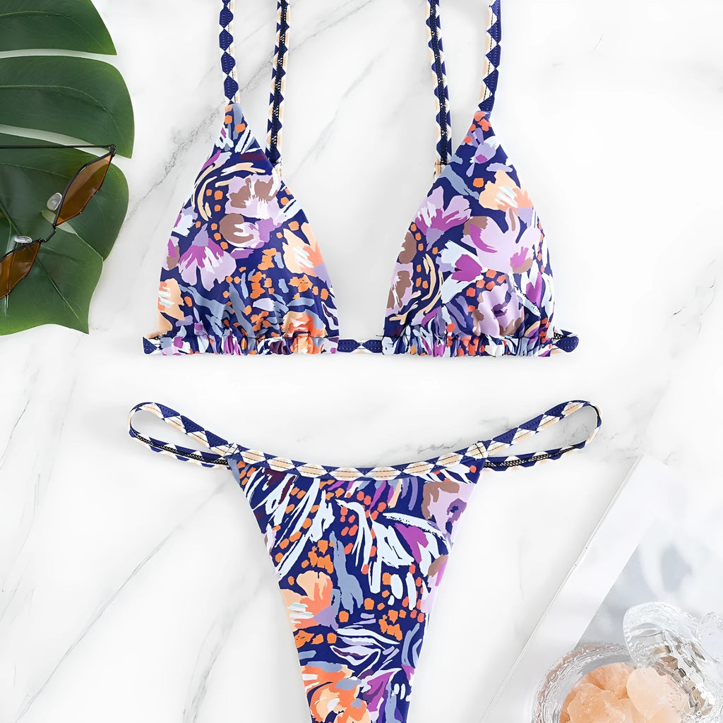 Women's floral print one-piece swimsuit with triangle bag design and split back in polyester.