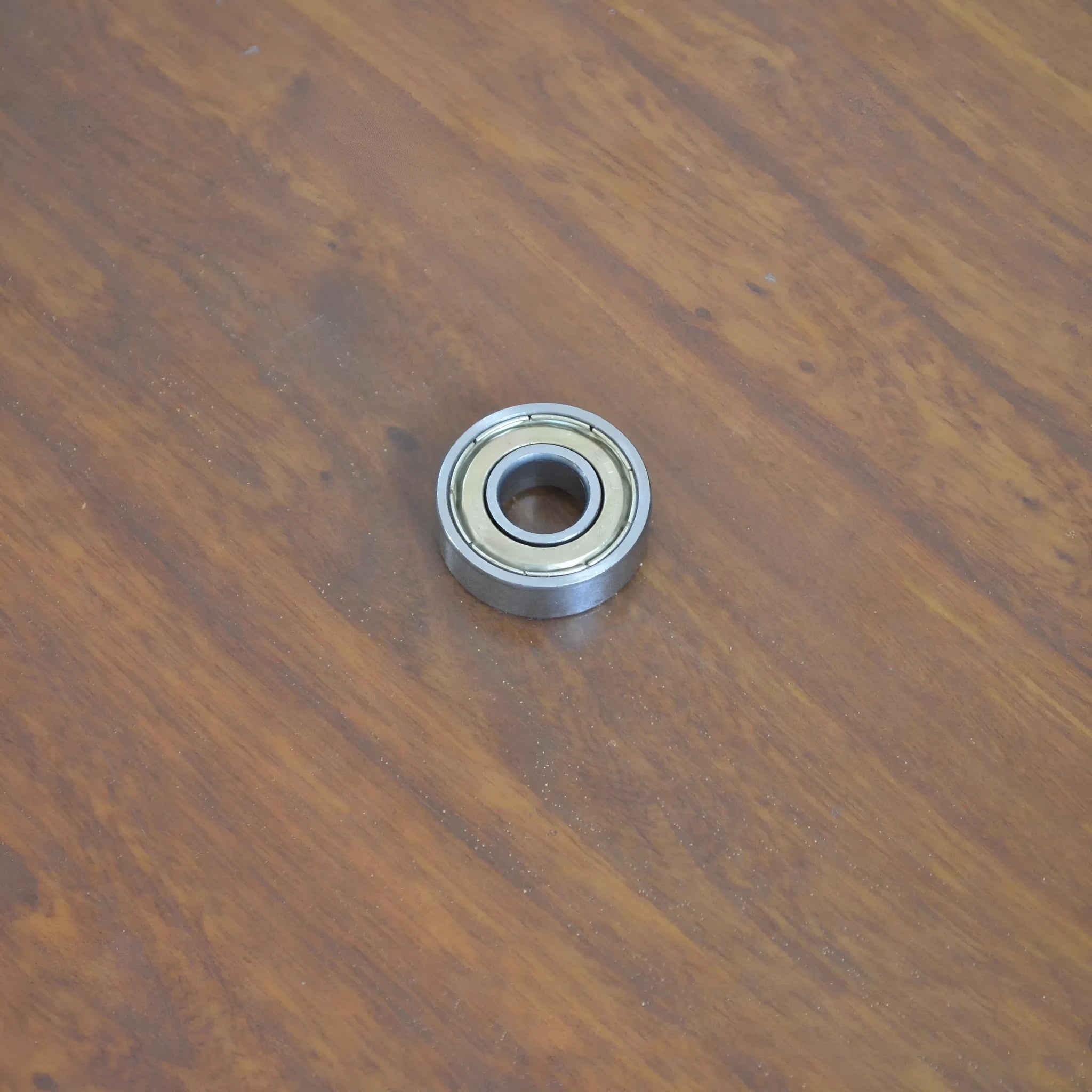 6000zz carbon steel miniature ball bearing showing 10mm inner diameter and 26mm outer diameter.