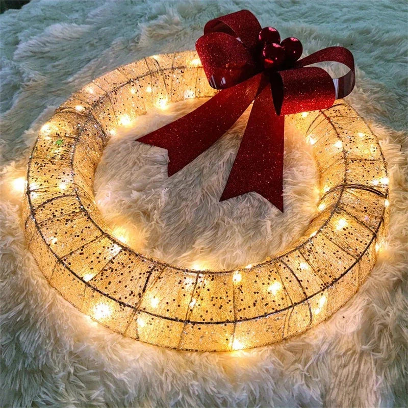 Festive 20-inch luminous LED Christmas wreath with gold and green tinsel garland and large bow