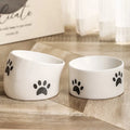 Ceramic cat bowl with slanted mouth design showing cat's paw pattern in yellow colour