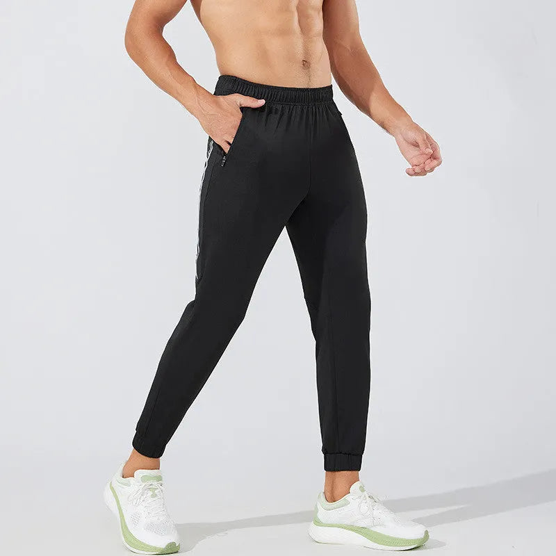 Men's black polyester running trousers with a mid-waist and full-length leg.