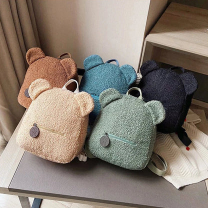 Cute, bear-shaped backpack made of soft, fleece material in various colors for casual travel and daily use