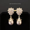 Women's drop-shaped pearl earrings with gemstone inlay in three colour variations