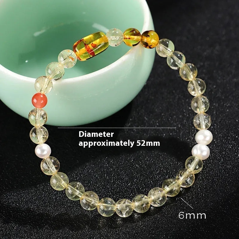 Women's white crystal beaded bracelet with yellow freshwater pearls and citrine yellow tower crystal accents