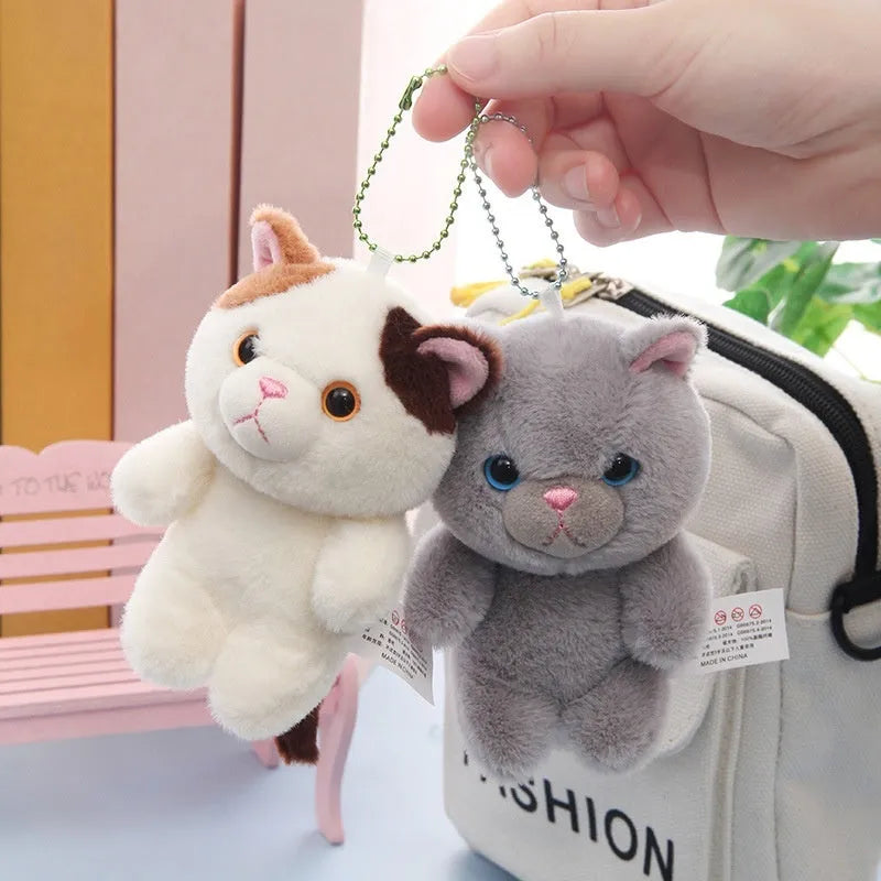 Cute cat sister doll soft plush 10cm tall with yellow eye beads on a table