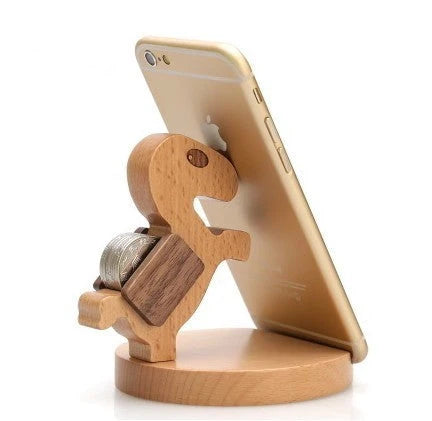 Custom lettering beech wood lazy phone holder with coin slot on a wooden table