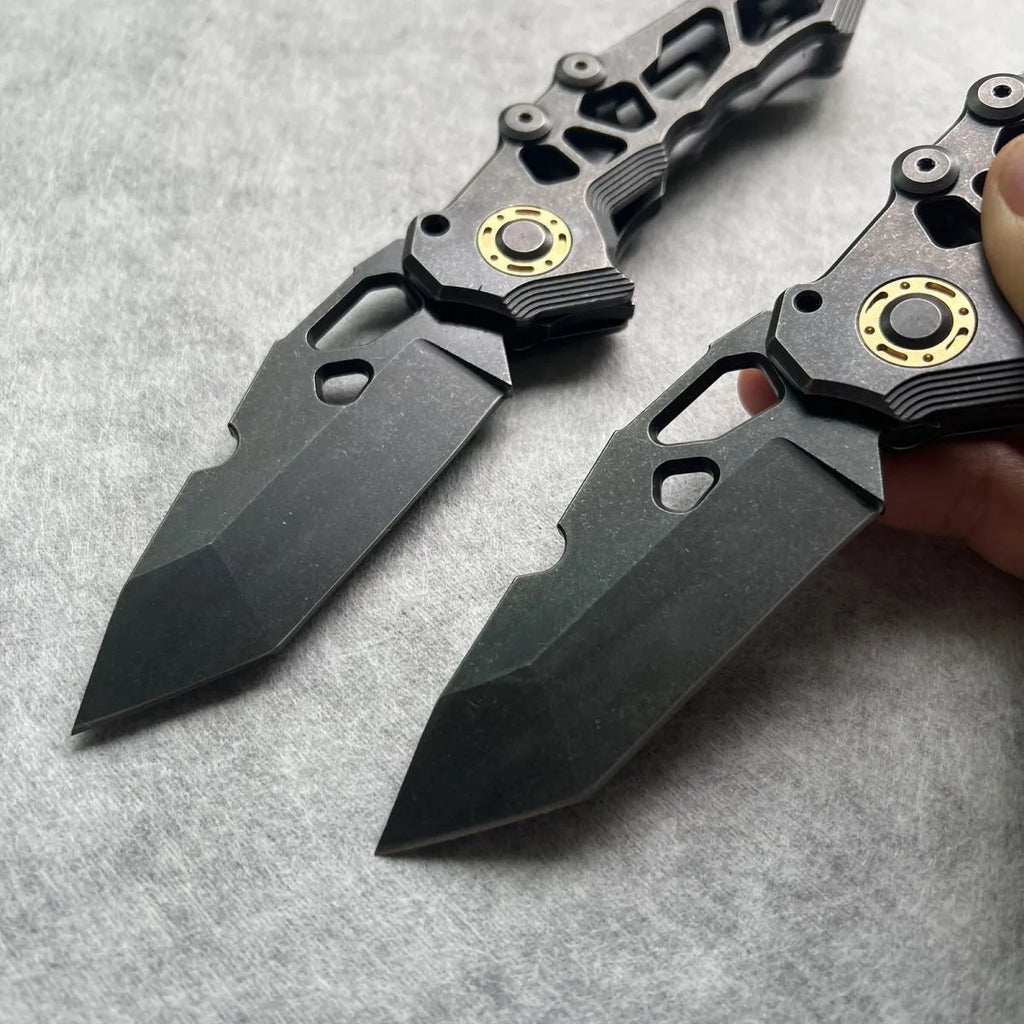 D2 steel folding knife with 9cm blade on outdoor background