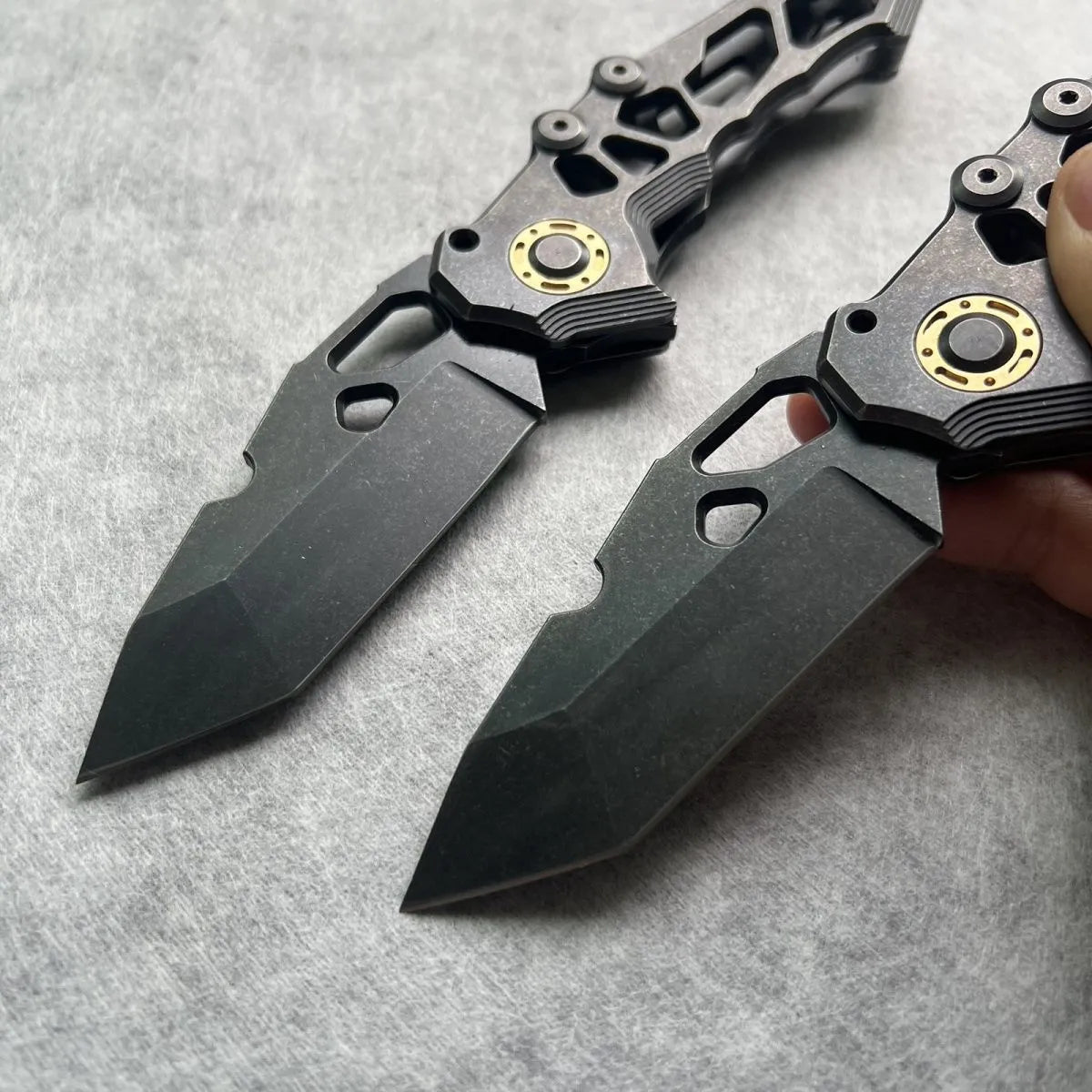 D2 steel folding knife with 9cm blade on outdoor background