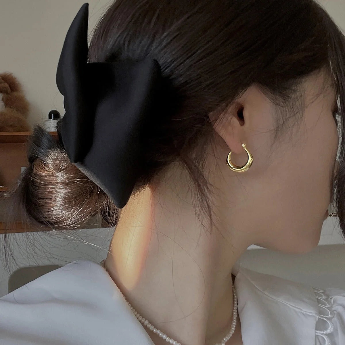 Small fat circle ear clips in white gold and yellow gold finishes for women