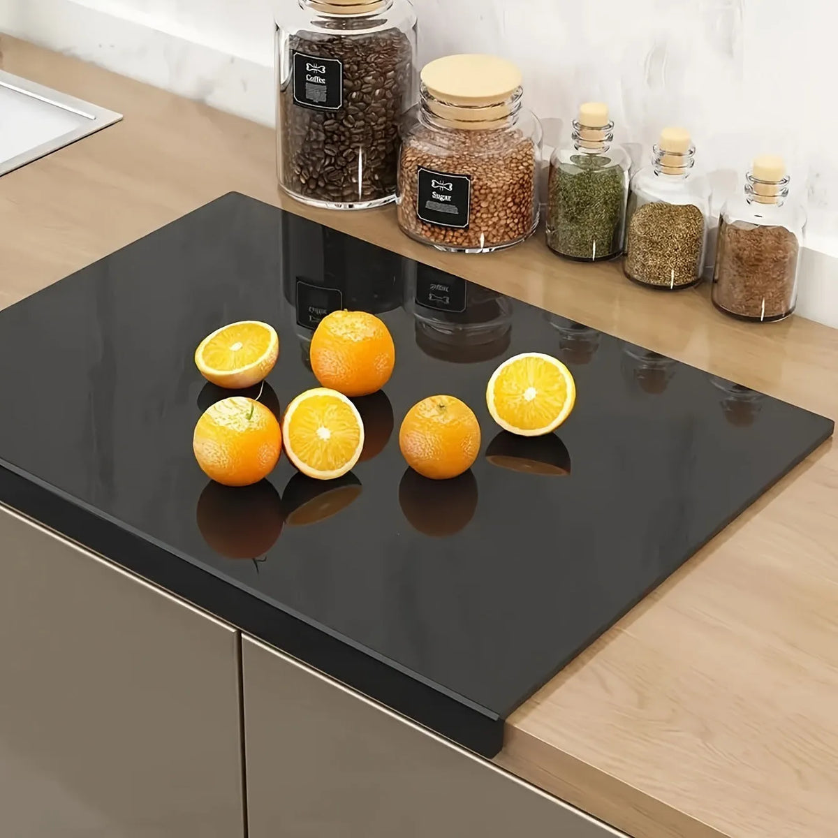 Black transparent acrylic chopping board on a kitchen worktop, available in three sizes up to 45x32cm