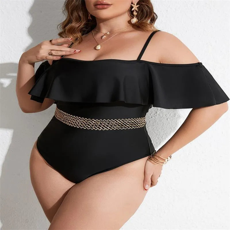 Black women's one-piece swimsuit on hanger, plus size range 0XL to 4XL.
