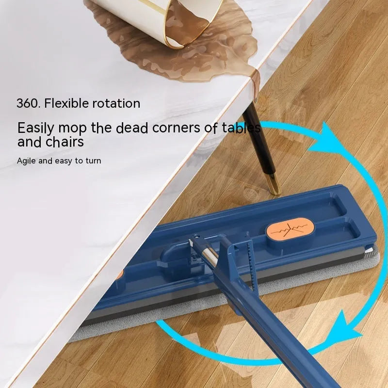Large flat mop with long stainless steel handle, blue rotating head, and integrated scraper on a hardwood floor.