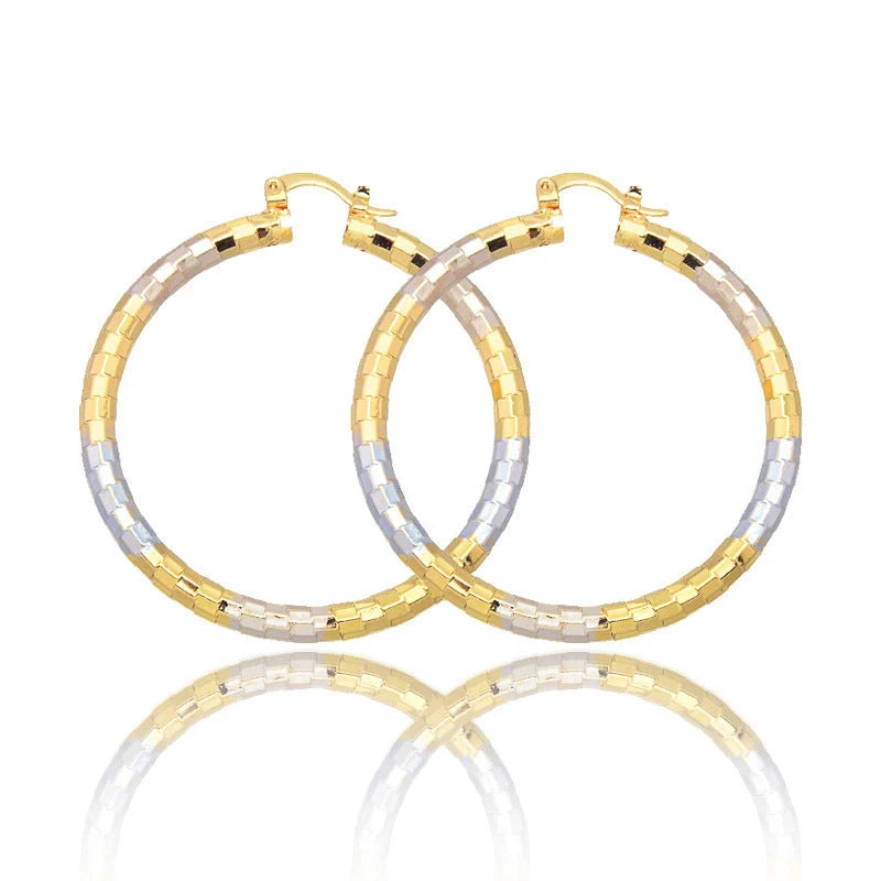 Gold geometric alloy earrings with ring detail, perfect for modern styling