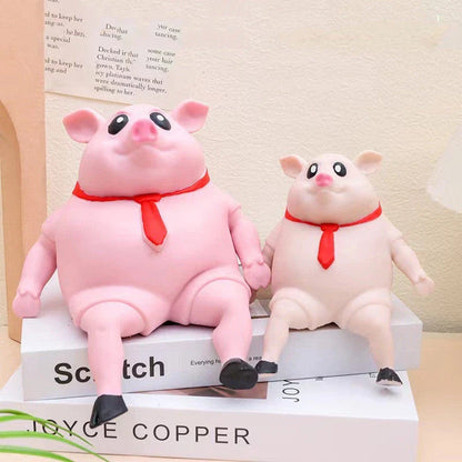 Piggy-shaped stress relief toys made from soft, eco-friendly rubber with cute scarf accents