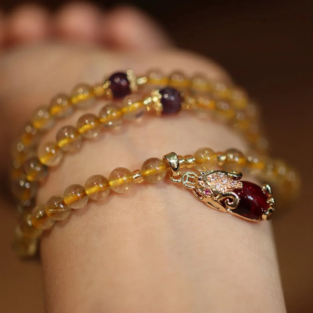 Natural Brazil rutilated quartz bracelet with golden needles and Chinese style hanging chopsticks design