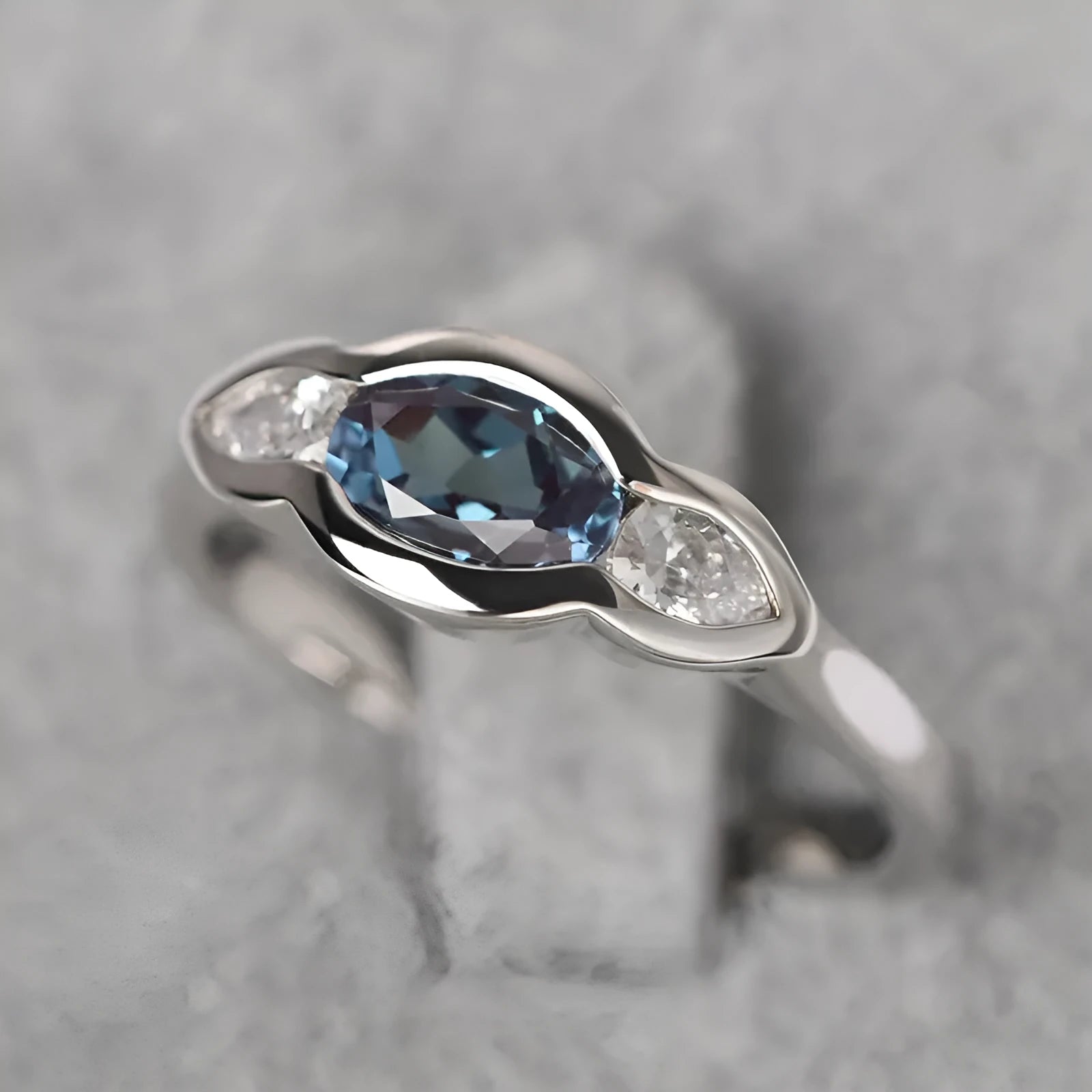 Women's geometric ellipse ring with zircon stone in white gold colour finish on model finger