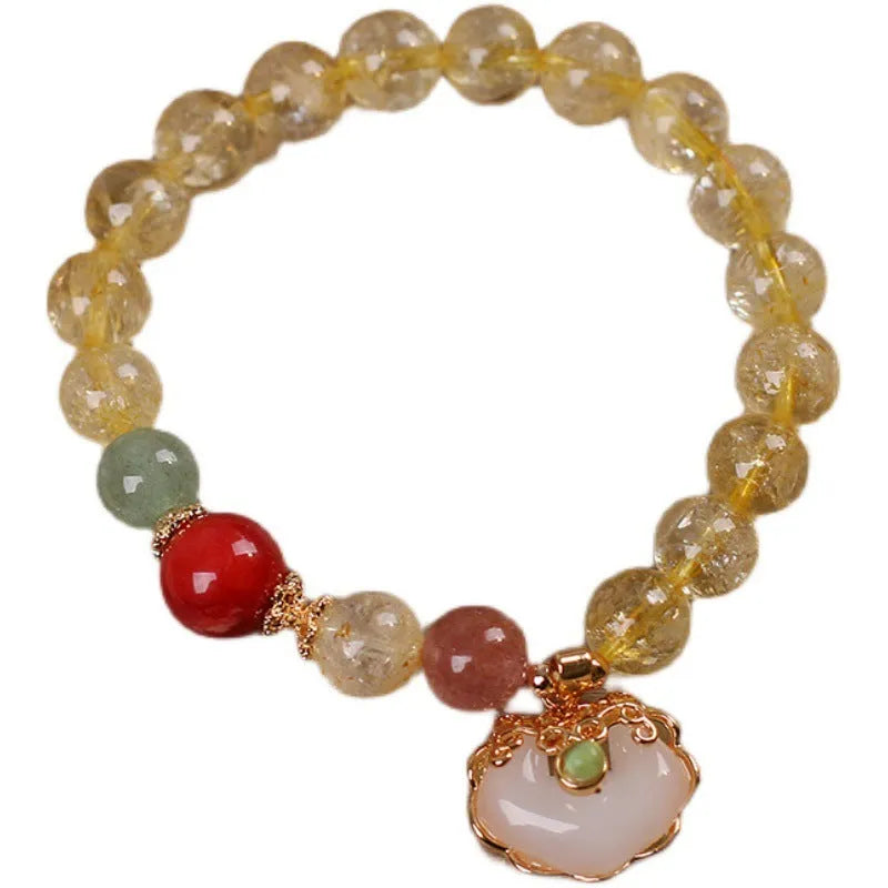 Women's alloy bracelet with a yellow natural citrine jade ruyi pendant.