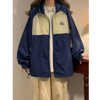 Women's summer sun protection top with raglan sleeves in apricot colour showing loose fit and splicing details