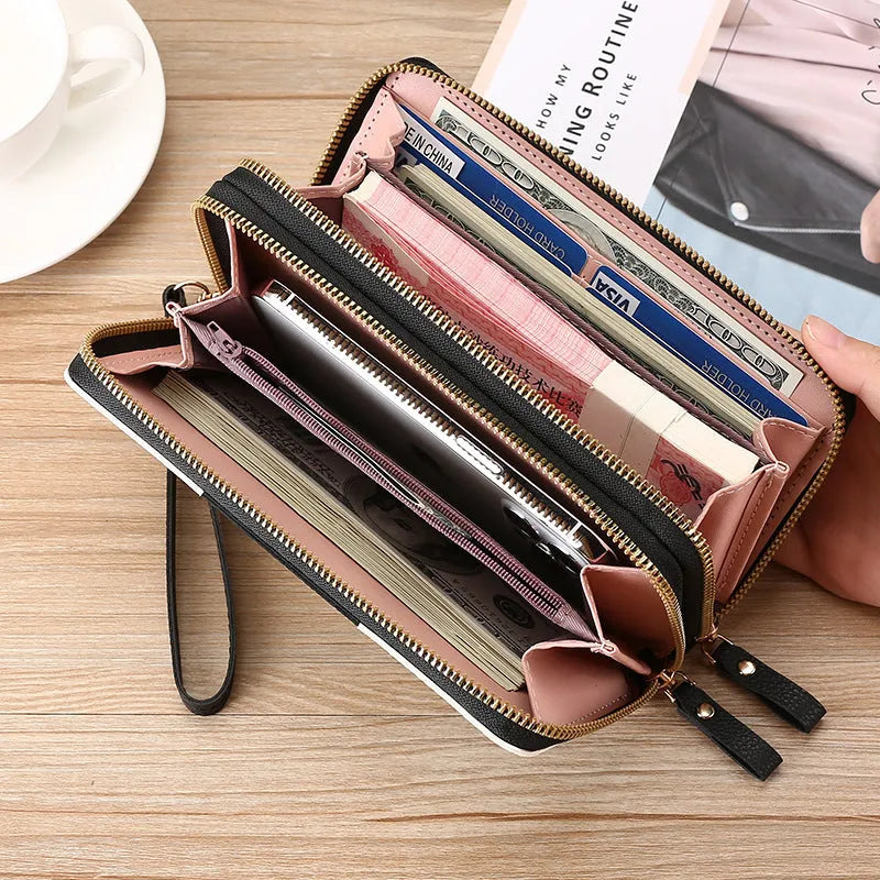 Long black PU leather wallet clutch with print detail showing mobile phone compartment and coin purse