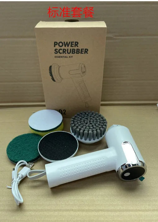 White cordless electric cleaning brush with interchangeable brush heads on a kitchen counter.