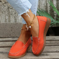 Women's black PU leather loafers with round toe and decorative car stitch detail on the upper.