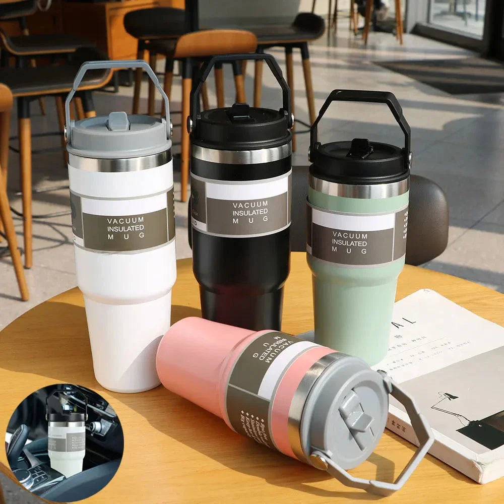 Insulated stainless steel travel tumbler with double-wall vacuum technology, sweat-proof powder coating, and BPA-free sliding lid for hot and cold drinks on the go.