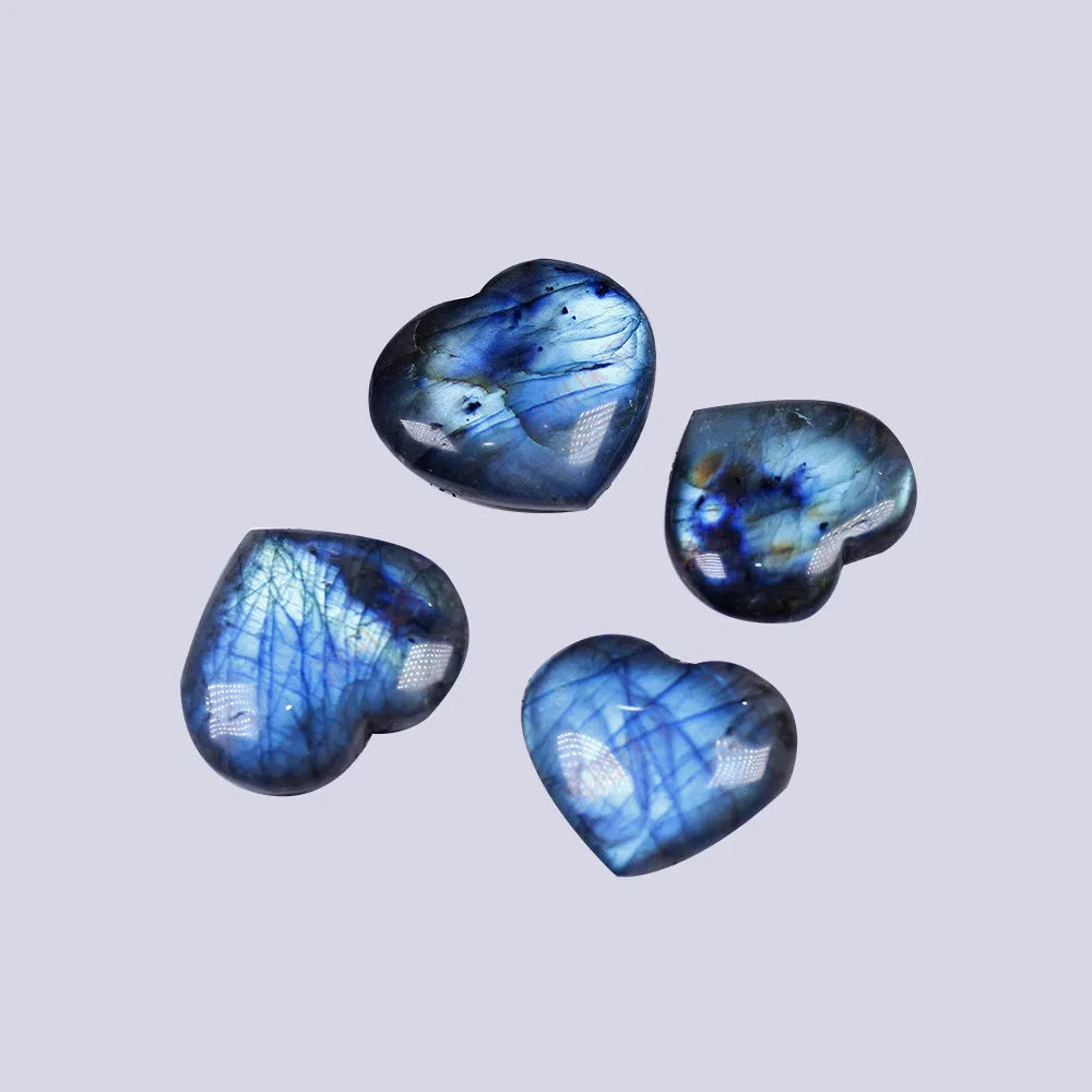 Natural blue pulled feldspar heart pendant with a handle detail on a white background.
