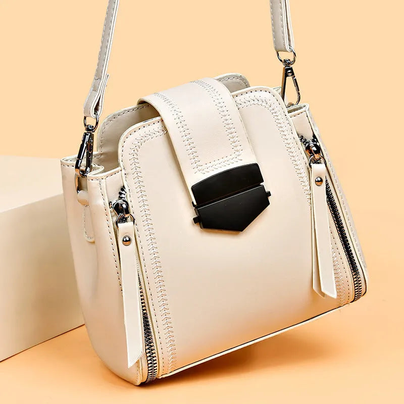 Soft black PU leather square vertical ladies handbag with textured stitching.