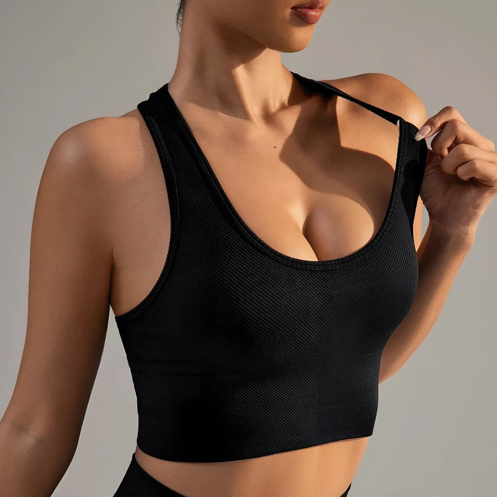 Black women's sports bra with cross back design for running and yoga