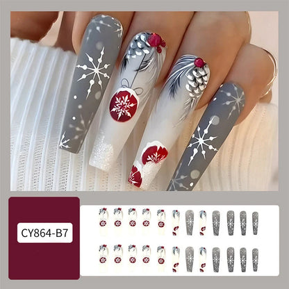 Christmas false nails with festive hat, striped, and snowflake designs for holiday parties