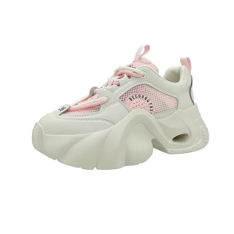 Women's beige casual sneakers with cross shoulder straps and a thick sole.