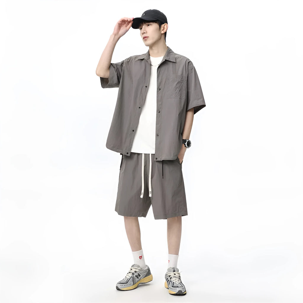 Men's loose grey hemp-blend casual shirt and shorts two-piece set on a hanger