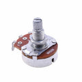 A single metal potentiometer knob for electric guitar tone or volume control.