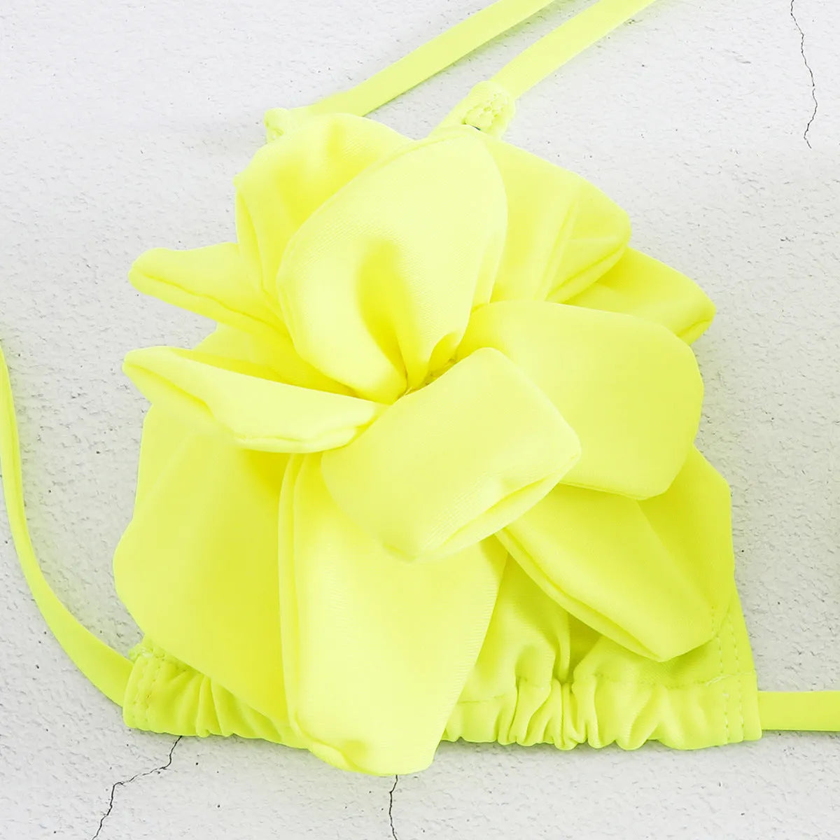 Low waist bikini swimsuit with 3D flower design in solid colour