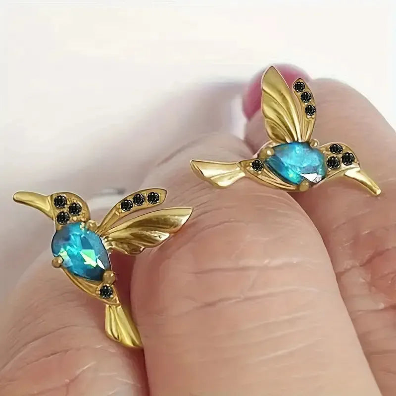Long, dangling bird-shaped earrings with zirconium wing details in red, blue, and red lvzuan colour options.