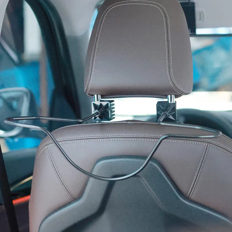 Black metal snap-on hat bracket mounted on a car rearview mirror