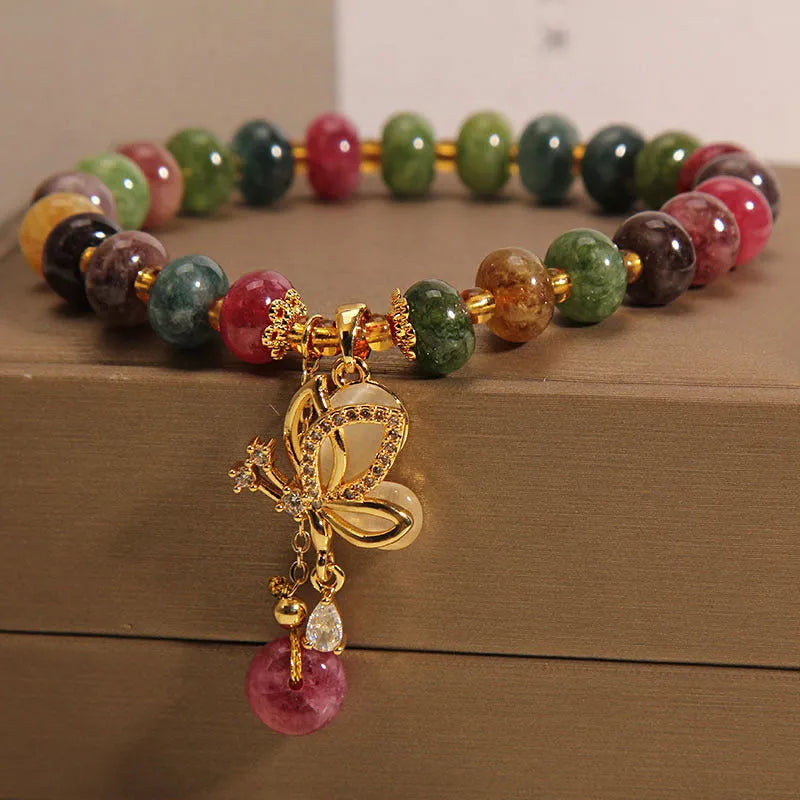 Colourful alloy bracelet for women with a butterfly charm and tourmaline beads on a fresh sweet style band.