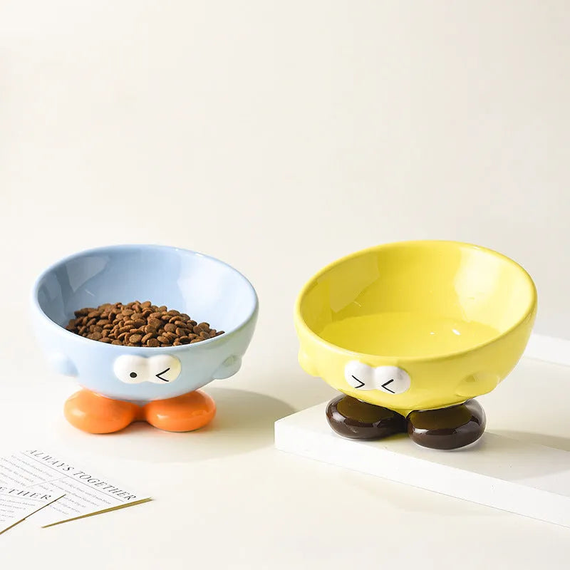 Blue tall ceramic pet food bowl with oblique shape and a silicone non-slip ring on the base.