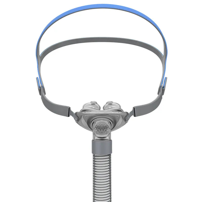 Ventilator nasal pillow mask kit showing silicone cushion, nose pad, and adjustable headband on a white background.