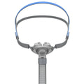 Ventilator nasal pillow mask kit showing silicone cushion, nose pad, and adjustable headband on a white background.