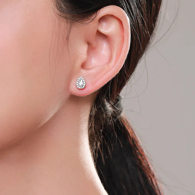 Women's silver drop ear studs with 925 sterling silver construction and diamond treatment finish